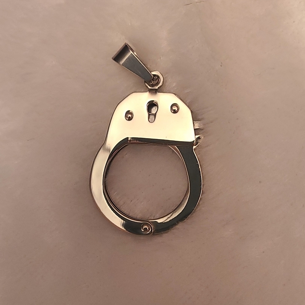Tiny handcuff pendant